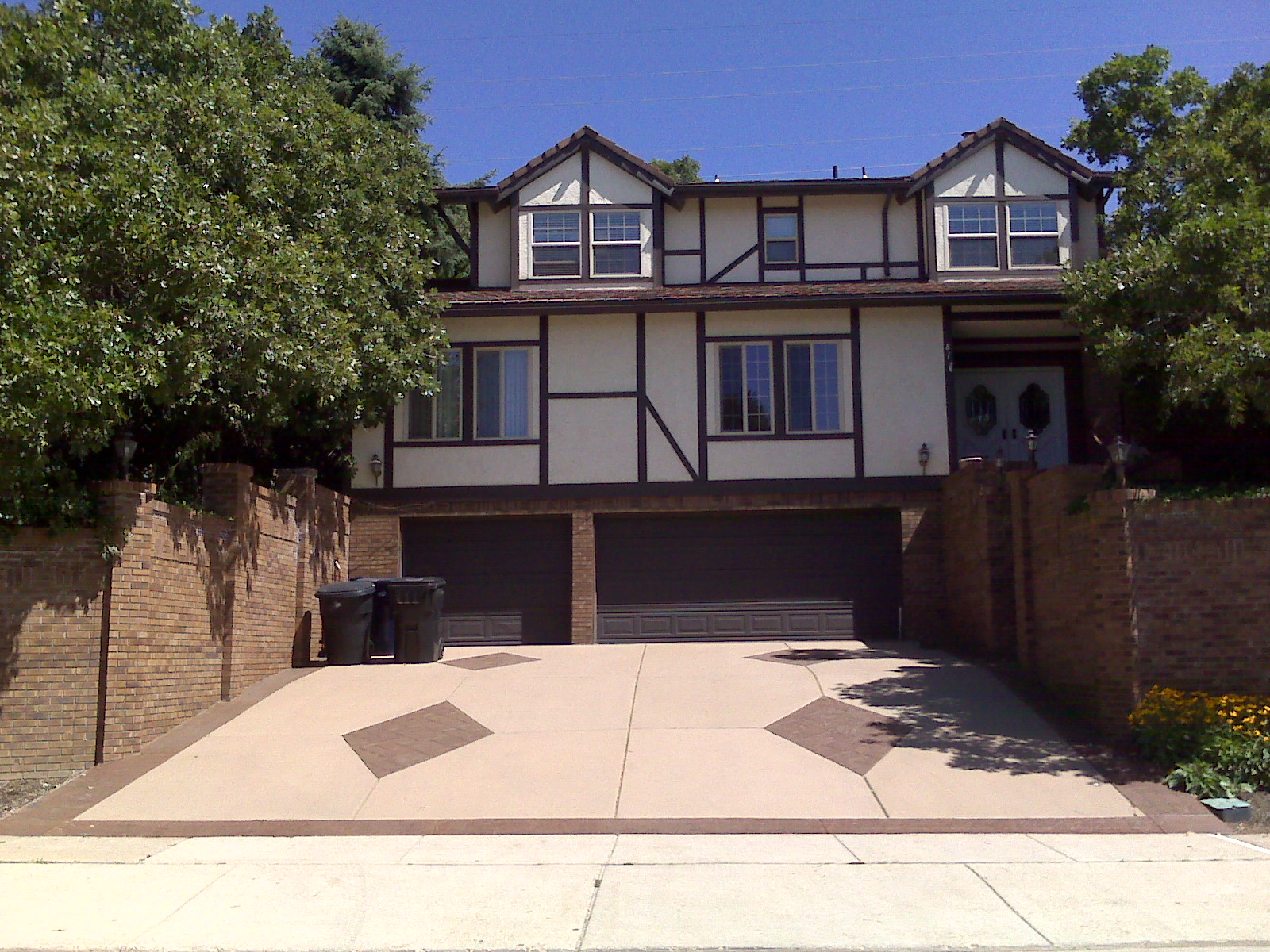 tutor house with brown driveway