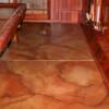 This basement floor was stained using a "dry brush" technique, a unique method of installing NewLook stains using a dry applicator brush. Colors may include Sunrise or Sierra Solid Base with a combination of Designer Series Enhancers, e.g. Dark Brown, Buffalo Brown, Spanish Clay, White, etc.